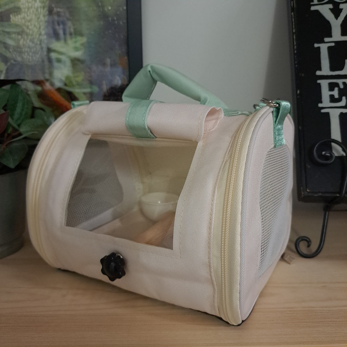 Small cream bird transport bag