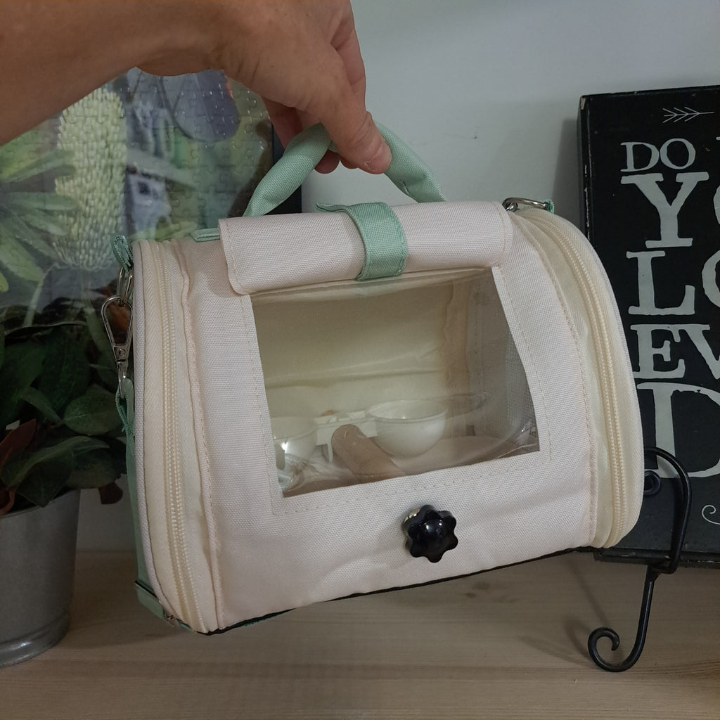 Small cream bird transport bag
