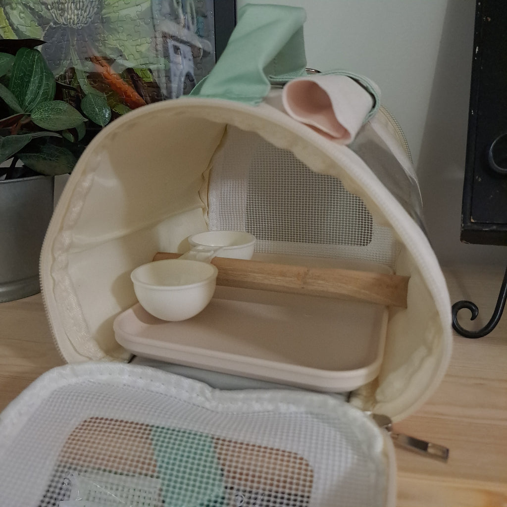 Small cream bird transport bag